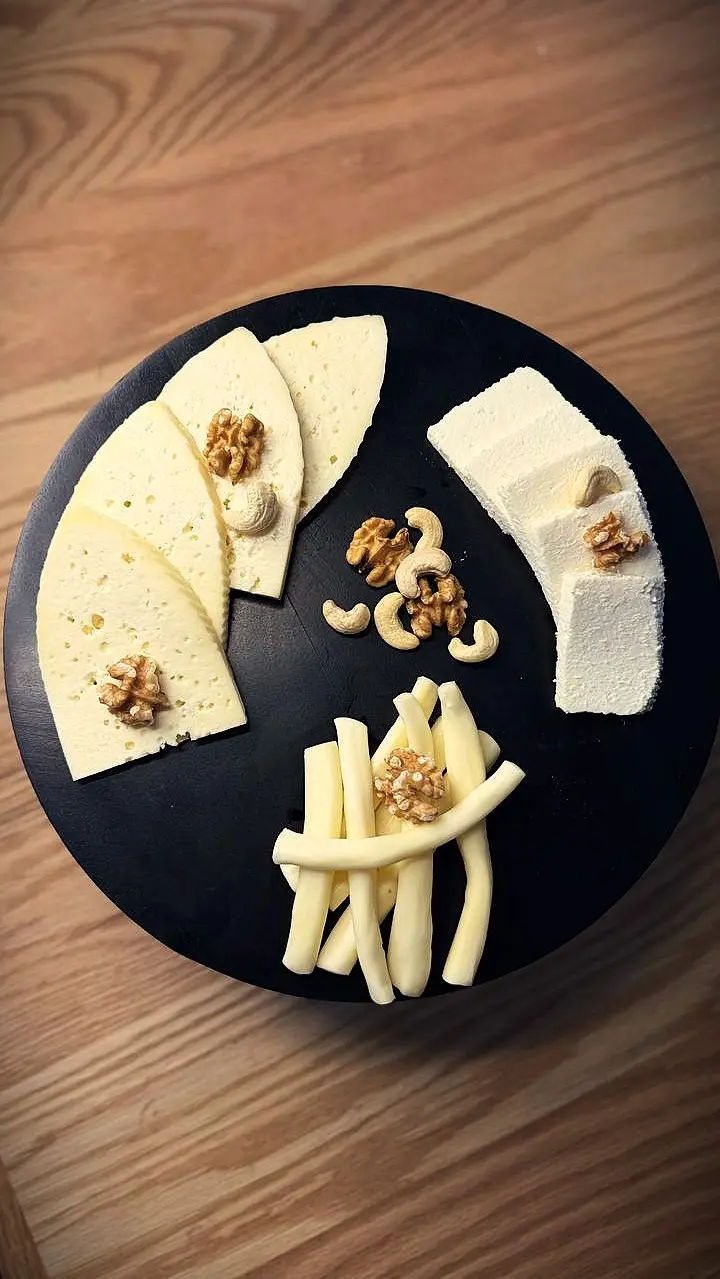Cheese plate Ossetian cheese , Adygean cheese , Cheese sticks